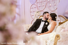 Adorable indian newlyweds kiss capture. Adorable indian newlyweds kiss capture.