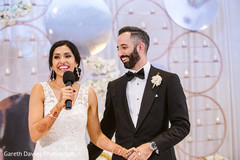 Indian bride and grooms capture during speech. Indian bride and grooms capture during speech.