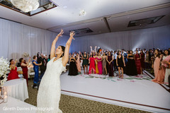 Maharani throwing her bouquet. Maharani throwing her bouquet.