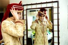 Indian groom putting his urban on. Indian groom putting his urban on.