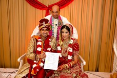 Lovely India couple holding their ceremony certificate. Lovely India couple holding their ceremony certificate.