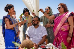 Indian relatives with groom at his haldi ritual. Indian relatives with groom at his haldi ritual.