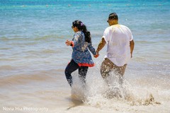 Indian bride and groom on their way to take off the turmeric paste. Indian bride and groom on their way to take off the turmeric paste.