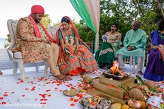 Indian couple stepping on nuts ritual. Indian couple stepping on nuts ritual.