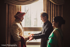 Indian groom receiving the traditional kirpan. Indian groom receiving the traditional kirpan.