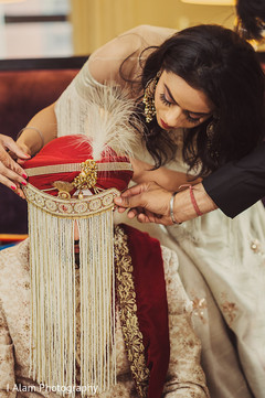 Indian groom being assisted by special guest. Indian groom being assisted by special guest.
