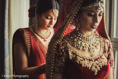 Gorgeous Maharani being assisted by beautiful guest. Gorgeous Maharani being assisted by beautiful guest.
