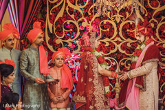 See this gorgeous couple holding hands during the ceremony. See this gorgeous couple holding hands during the ceremony.