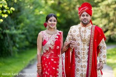 Indian bride and groom outdoors posing for pictures. Indian bride and groom outdoors posing for pictures.