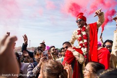 Indian groom being lifted by special guests. Indian groom being lifted by special guests.