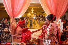 Groom and bride during the nuptials. Groom and bride during the nuptials.