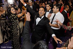 Indian bride and groom dancing during reception party Indian bride and groom dancing during reception party