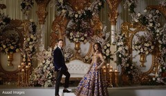 Stunning Indian bride and groom at reception stage photo. Stunning Indian bride and groom at reception stage photo.