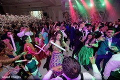 Indian bride dancing with guests on her wedding reception party Indian bride dancing with guests on her wedding reception party