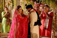 Indian bride putting flower garland to groom Indian bride putting flower garland to groom