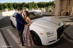 Mesmerizing indian couple posing in front of their car transportation Mesmerizing indian couple posing in front of their car transportation