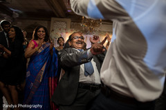 Guests dancing and laughing in the reception party. Guests dancing and laughing in the reception party.