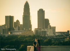 Lovely Indian couple on top of a building capture. Lovely Indian couple on top of a building capture.