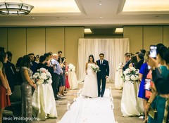 Enchanting Indian bride walking on the aisle to her wedding. Enchanting Indian bride walking on the aisle to her wedding.