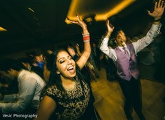 Indian bride at her upbeat reception party. Indian bride at her upbeat reception party.