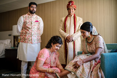 Groom's mother putting stunning anklet on Maharani. Groom's mother putting stunning anklet on Maharani.