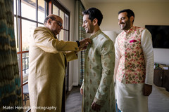 Indian groom being assisted by his relatives. Indian groom being assisted by his relatives.
