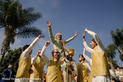 Joyful Indian groom lifted by his groomsmen. Joyful Indian groom lifted by his groomsmen.