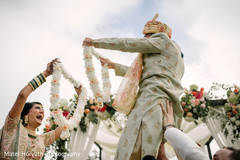 Joyful Indian couple exchanging garlands. Joyful Indian couple exchanging garlands.