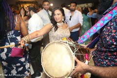 Maharani playing the dhol. Maharani playing the dhol.