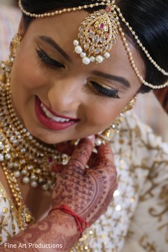 Indian bride wearing the tikka prior to the ceremony. Indian bride wearing the tikka prior to the ceremony.