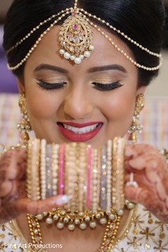 Indian bride holding her ceremony bangle. Indian bride holding her ceremony bangle.