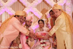 The Indian couple and family during the ceremony. The Indian couple and family during the ceremony.
