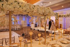 Stunning table and floral design setup for the reception. Stunning table and floral design setup for the reception.