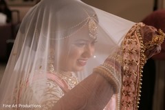 The gorgeous Maharani under the baby pink ghunghat.