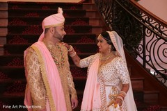 Indian bride wearing the ivory bridal saree with pink ghunghat. Indian bride wearing the ivory bridal saree with pink ghunghat.