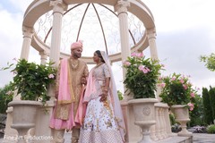 Indian couple wearing traditional attires during the photo shoot. Indian couple wearing traditional attires during the photo shoot.