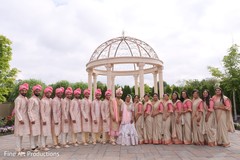 Groomsmen and bridesmaids posing with the Indian couple. Groomsmen and bridesmaids posing with the Indian couple.