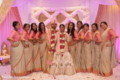 Lovely Indian bridesmaids posing with the Raja and Maharani. Lovely Indian bridesmaids posing with the Raja and Maharani.