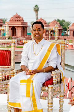 Indian groom with his wedding ceremony outfit Indian groom with his wedding ceremony outfit
