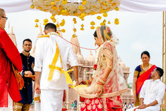 Indian bride and groom walking the seven steps around sacred fire Indian bride and groom walking the seven steps around sacred fire