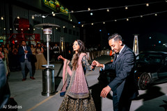 Indian bride and groom arriving to their reception party Indian bride and groom arriving to their reception party