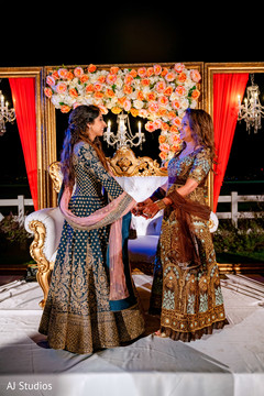 Indian bride's mother holding hands with maharani Indian bride's mother holding hands with maharani