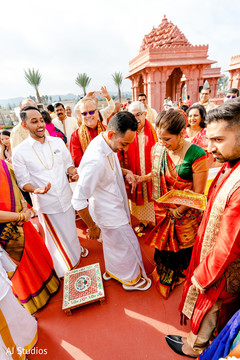 Indian groom greeted by the bride's parents and relatives Indian groom greeted by the bride's parents and relatives