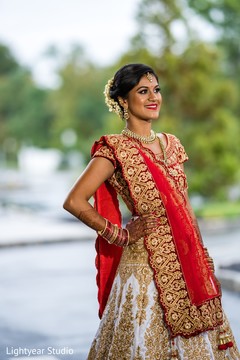 Indian bride wearing the bridal burgundy Dupatta. Indian bride wearing the bridal burgundy Dupatta.