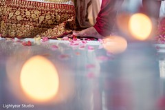Indian bride and groom during the Saptapadi rituals. Indian bride and groom during the Saptapadi rituals.