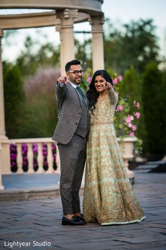 Indian bride and Raja posing during the outdoor photoshoot. Indian bride and Raja posing during the outdoor photoshoot.