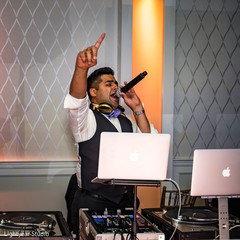 The DJ hyping the Indian wedding guests. The DJ hyping the Indian wedding guests.
