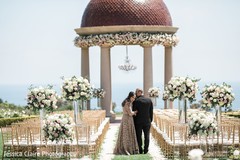 Indian couple posing at ceremony aisle. Indian couple posing at ceremony aisle.