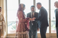 Indian groom putting ring to bride. Indian groom putting ring to bride.