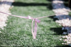 Closeup capture of Indian wedding aisle pink bow. Closeup capture of Indian wedding aisle pink bow.